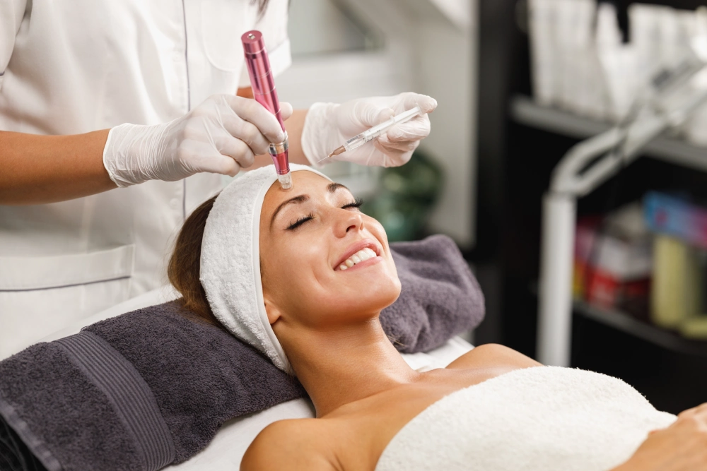 A woman getting her face waxed at the spa