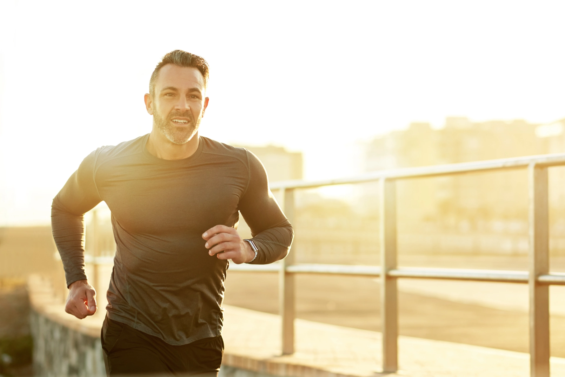 A man running outside in the sun